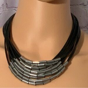 Black leather necklace with silver beads and silver clasp